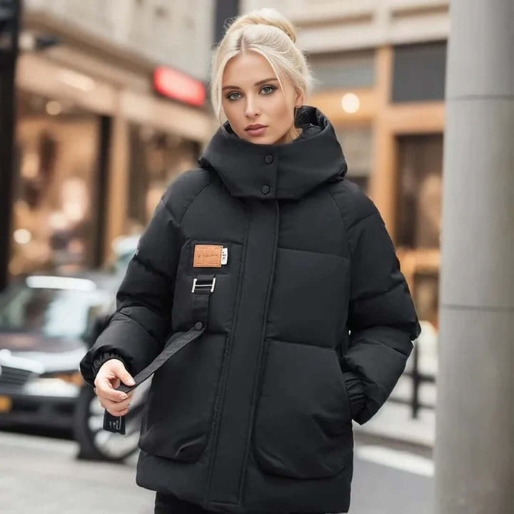 Stylish hip-length women's winter jacket, designed for warmth and a chic casual outerwear look.
