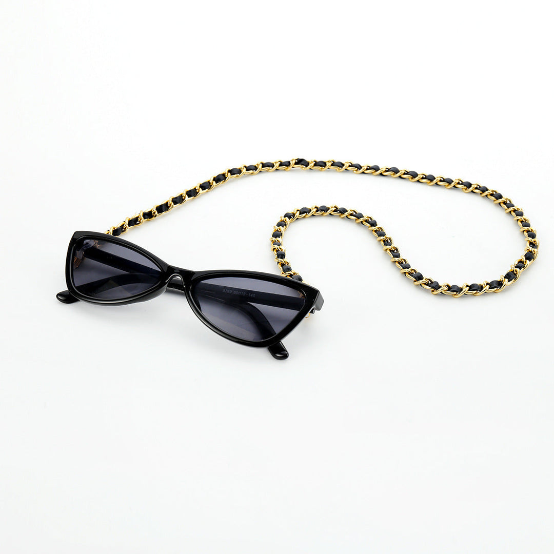 Fashionable cat-eye sunglasses with secure chain strap, providing UV protection for chic women's eyewear.