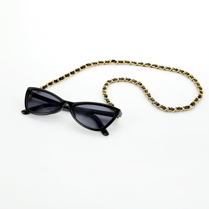 Fashionable cat-eye sunglasses with secure chain strap, providing UV protection for chic women's eyewear.