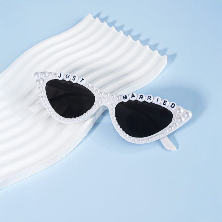 Trendy cat-eye sunglasses with rhinestone frames, offering stylish UV eye protection for women.