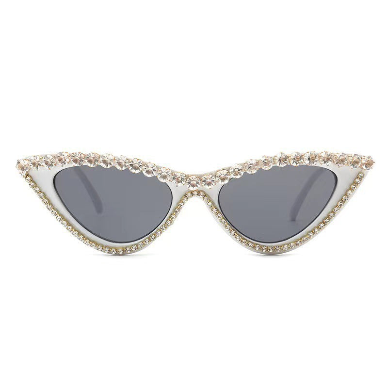 Sparkling rhinestone cat-eye sunglasses for women, a glamorous fashion accessory with UV protection.
