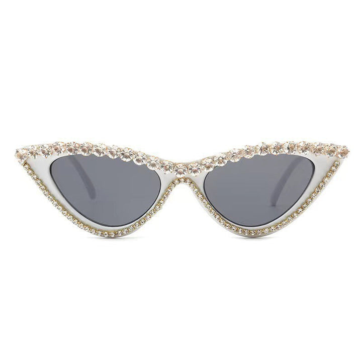 Sparkling rhinestone cat-eye sunglasses for women, a glamorous fashion accessory with UV protection.