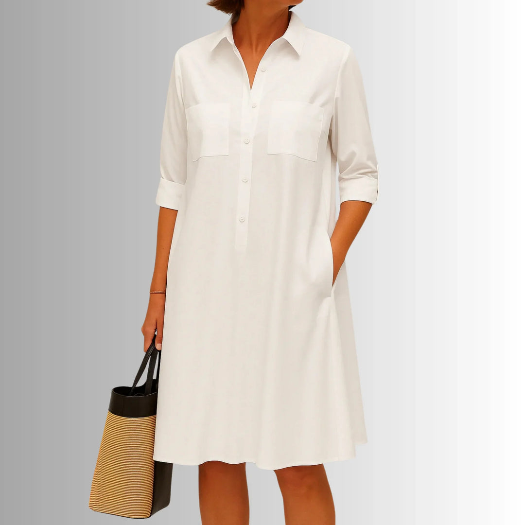 Elegant women's shirt mini dress. Button-down collared design with 3/4 sleeves, ideal for chic daywear.