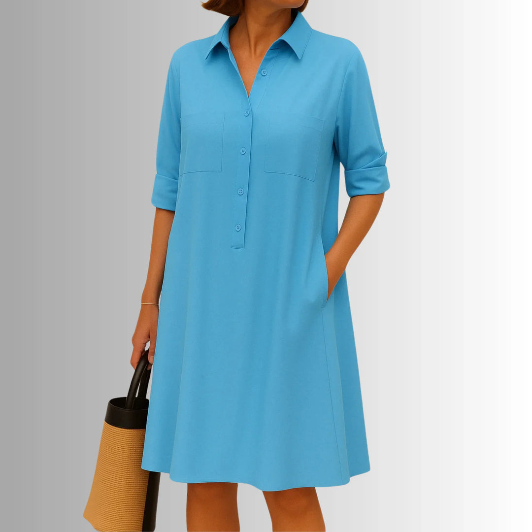 Women's collared button-front mini shirt dress with 3/4 sleeves. A stylish and comfortable A-line day dress.