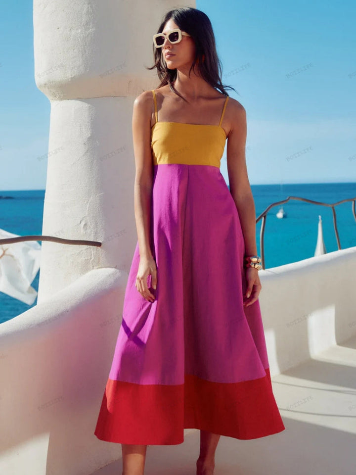 Chic women's color block spaghetti strap midi dress. Elegant summer fashion, versatile for day or night events.