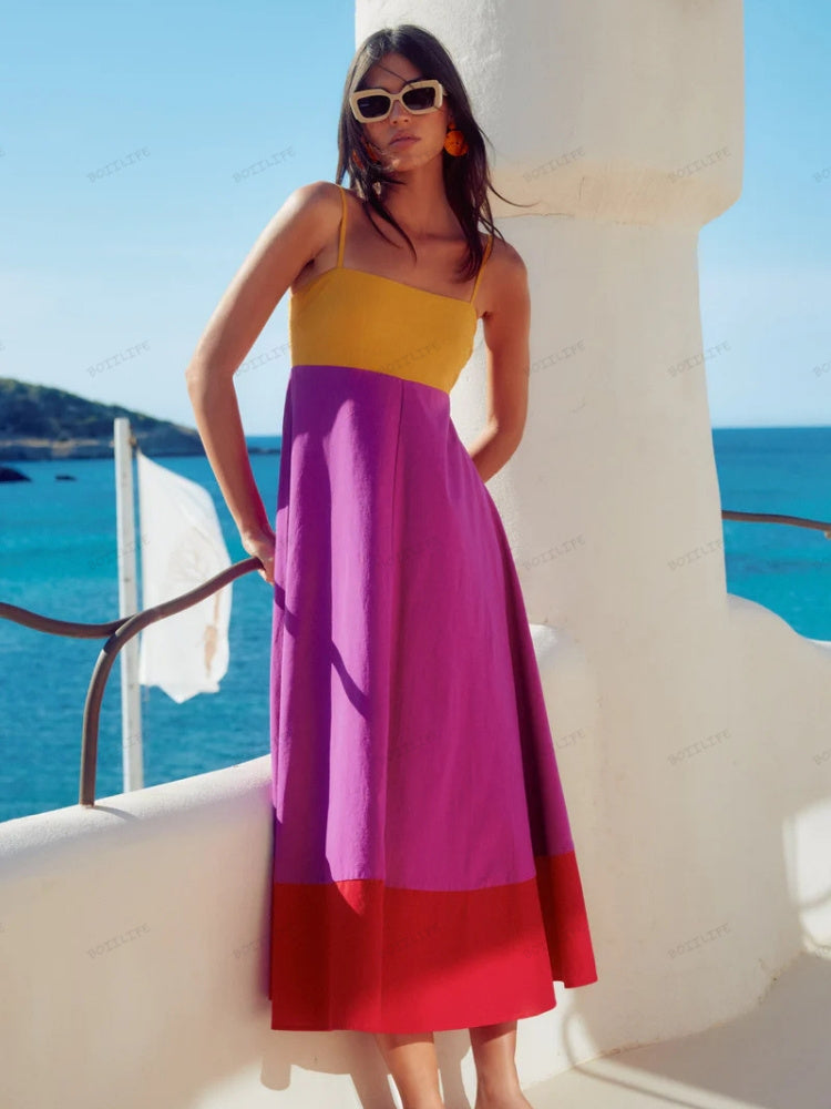 Elegant women's midi dress with color block design & spaghetti straps. Perfect chic summer day to night wear.