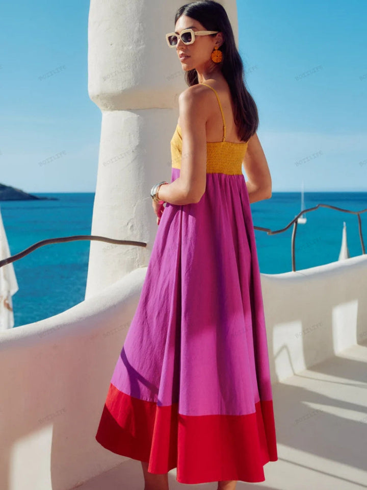 Stylish women's color block midi dress with thin spaghetti straps, ideal for elegant summer events & fashion.