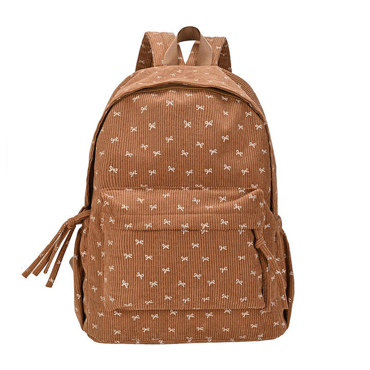 Chic women's corduroy backpack, perfect for everyday style. Features adjustable straps, durable fabric for school & travel.