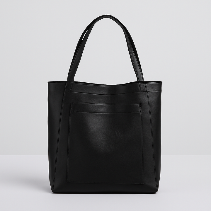Elegant black faux leather tote shoulder bag for women. Spacious everyday handbag with minimalist design & versatility.