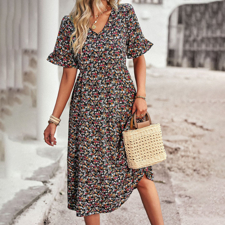 Elegant women's midi dress with vibrant floral print, ideal for warm weather or casual summer days.