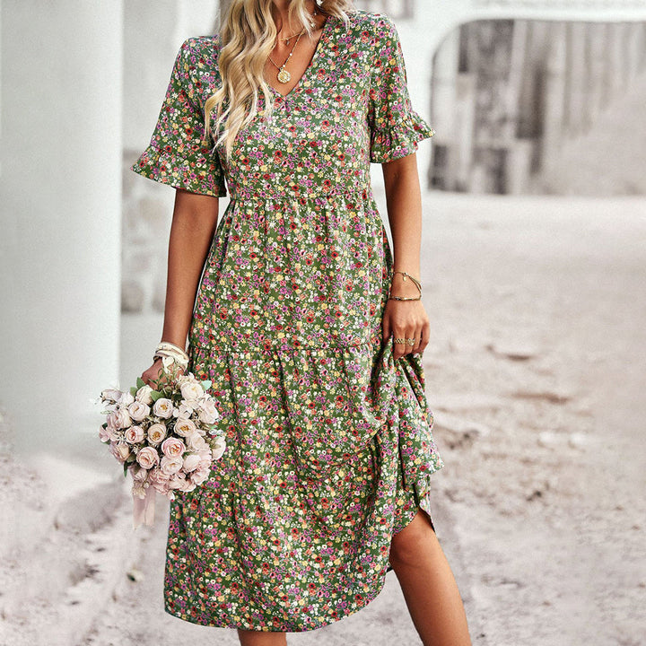Comfortable women's floral summer midi dress. Chic design, sleeveless, perfect for casual or elegant warm weather outings.