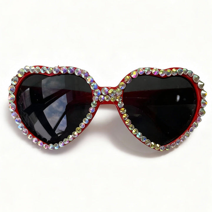 Chic women's heart-shaped sunglasses with dazzling rhinestones, perfect fashion accessory for summer.