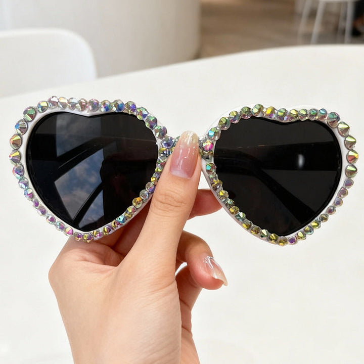 Dazzling heart-shaped rhinestone sunglasses for women, a statement fashion accessory for sunny days.