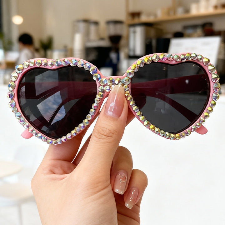 Statement women's heart sunglasses, sparkling rhinestones, chic and glamorous UV protection eyewear.