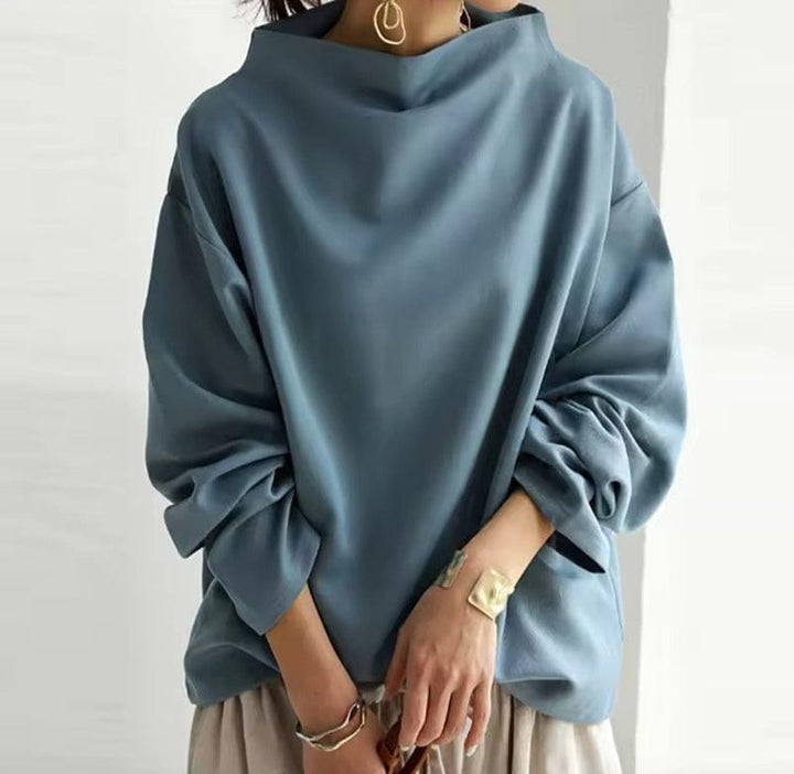 Stylish women's high-neck long sleeve top. A chic, versatile piece for casual or office wear. Wardrobe essential.