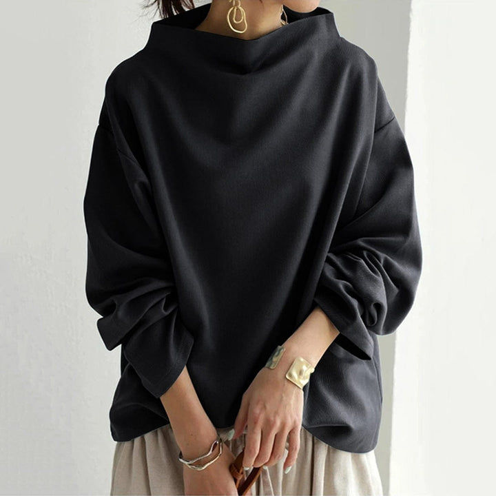 Versatile women's high-neck long sleeve top, ideal for casual outfits or dressed-up elegant looks. A wardrobe staple.
