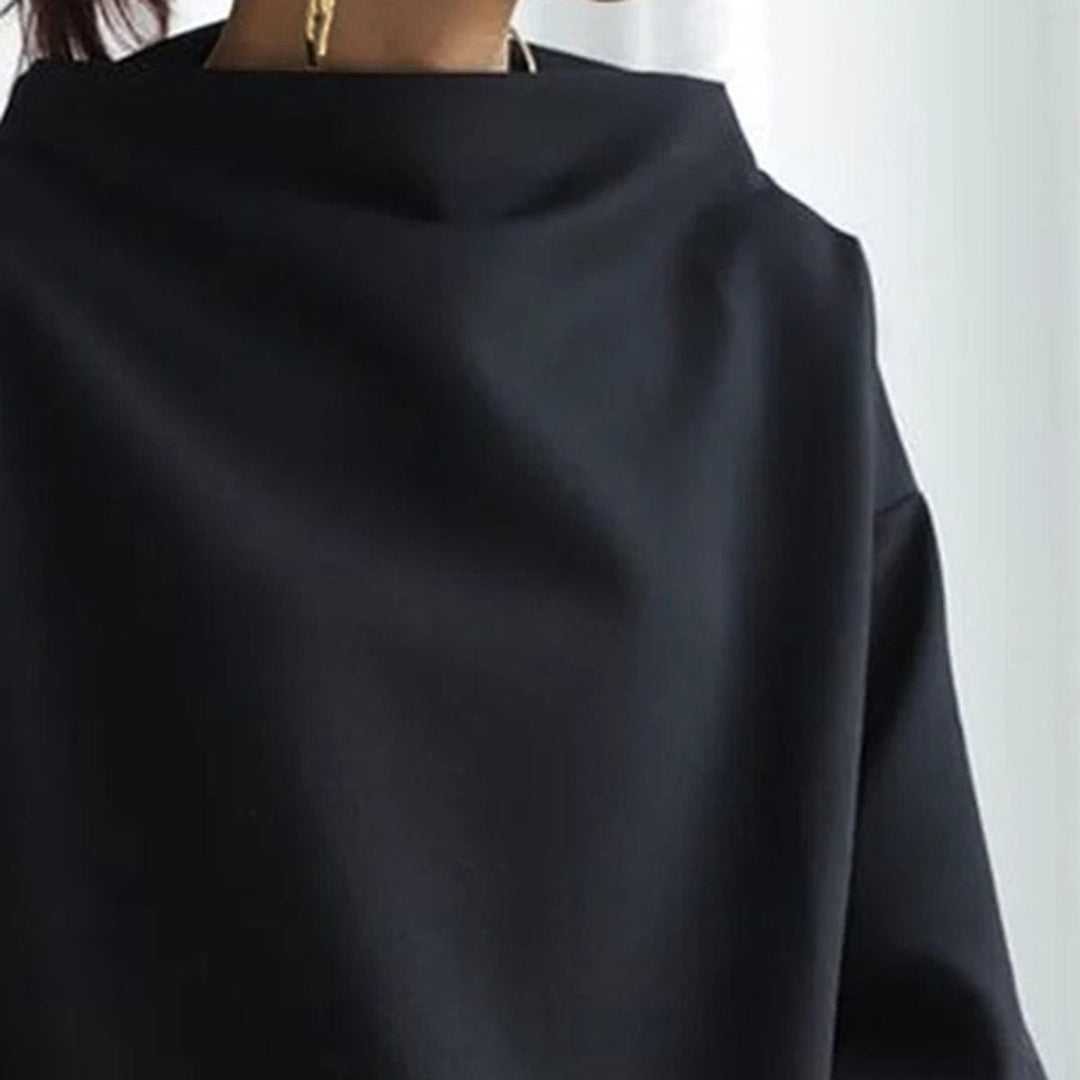 Close-up of a women's high-neck long sleeve top, highlighting the chic design. Essential for women's fashion.