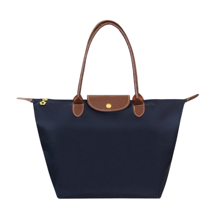 Woman carrying a stylish large capacity women's tote shoulder bag. Perfect everyday carry and fashion accessory.