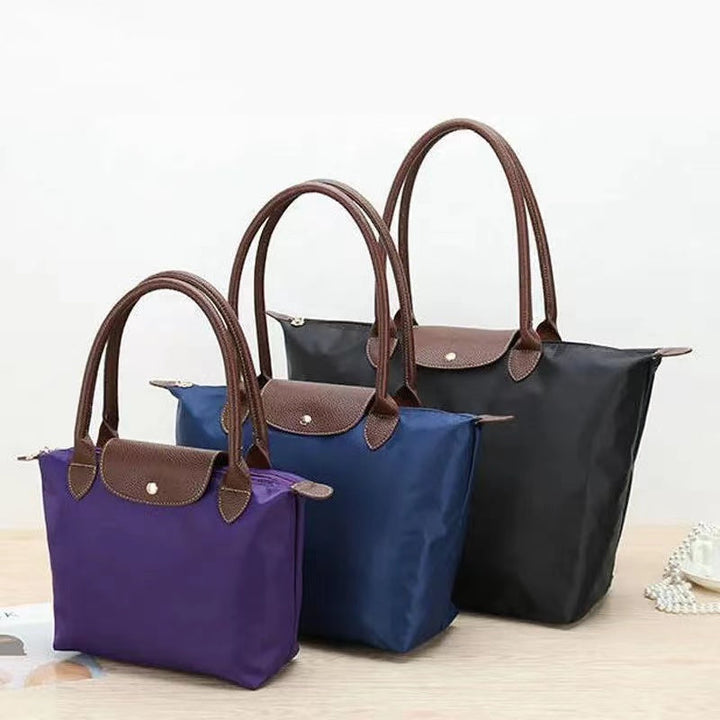 Elegant women's large tote shoulder bag, spacious for daily carry & travel. Chic, versatile, secure fashion accessory.