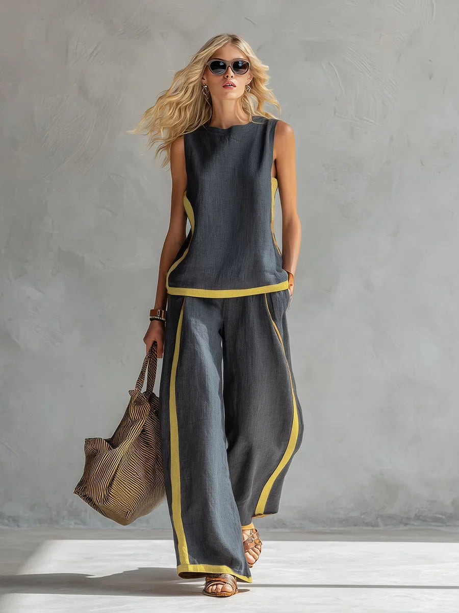 Chic women's matching set with sleeveless top & wide leg pants, featuring stylish contrast trim.