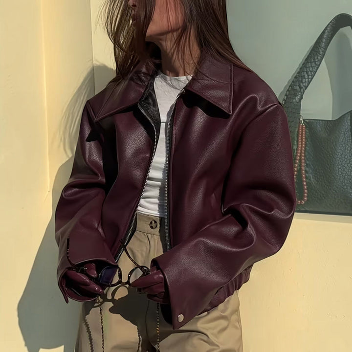 Chic women's moto jacket with a stylish lapel collar, perfect for versatile outerwear fashion.