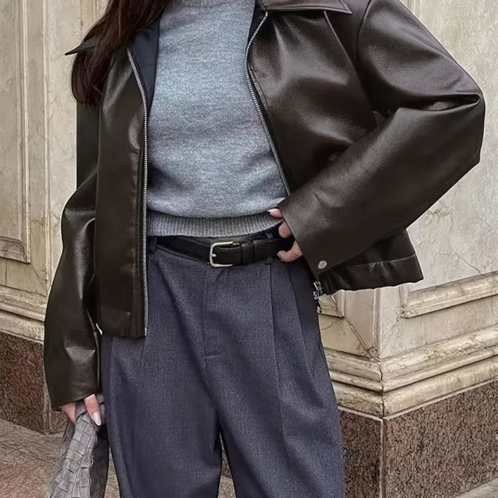 Sleek women's moto jacket, an all-season outerwear piece with a chic lapel collar and versatile appeal.