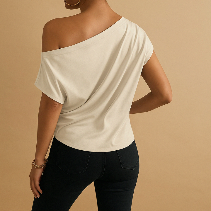 Elegant women's off-shoulder top. Versatile short sleeve batwing design for chic summer fashion & casual comfort.