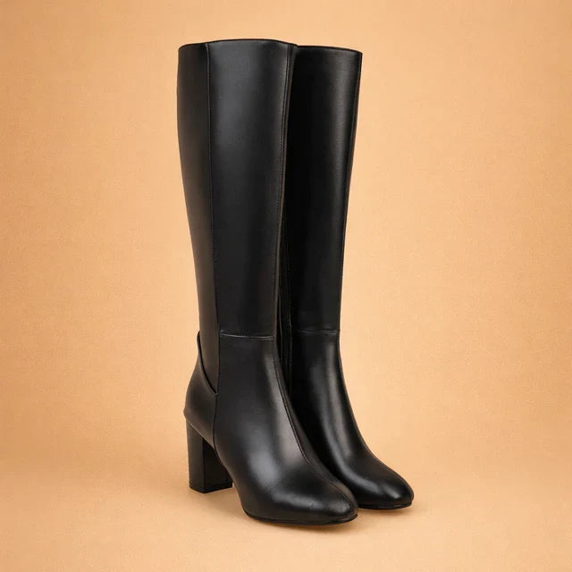 Elegant women's over-the-knee high heel boots. Trendy tall boots, essential for chic winter fashion.