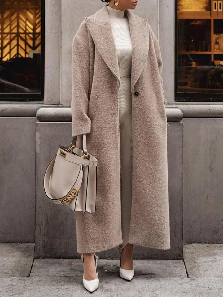 Streetwear inspired loose fit women's long sleeve coat. Stylish button-front outerwear.
