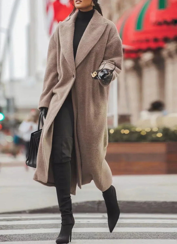 Autumn fashion women's oversized jacket. Chic lapel coat with a loose fit for winter.