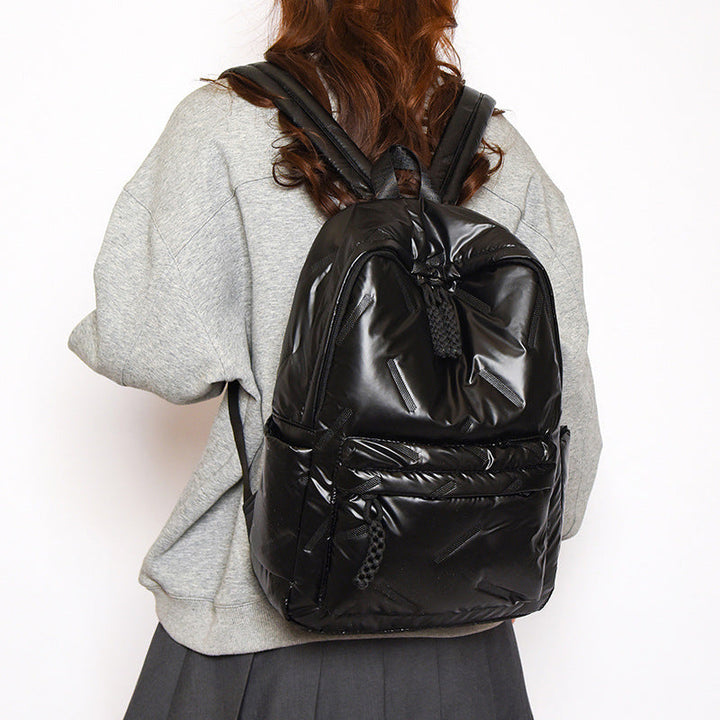 Spacious women's travel backpack with padded straps, ideal for daily commutes & weekend trips.