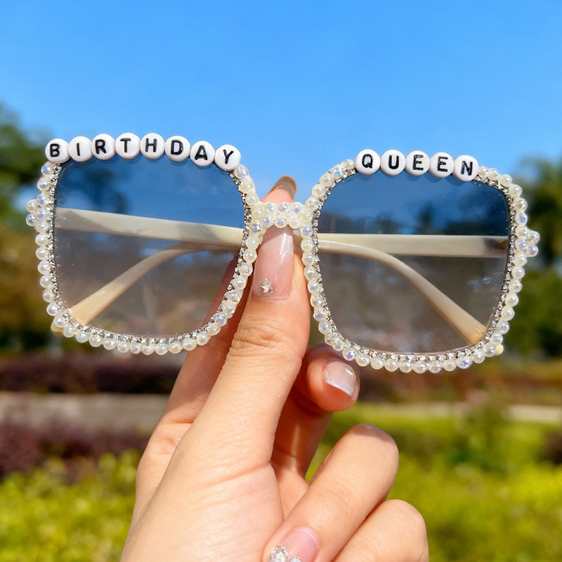 Chic women's pearl-embellished square statement sunglasses; glamorous fashion eyewear with UV protection.