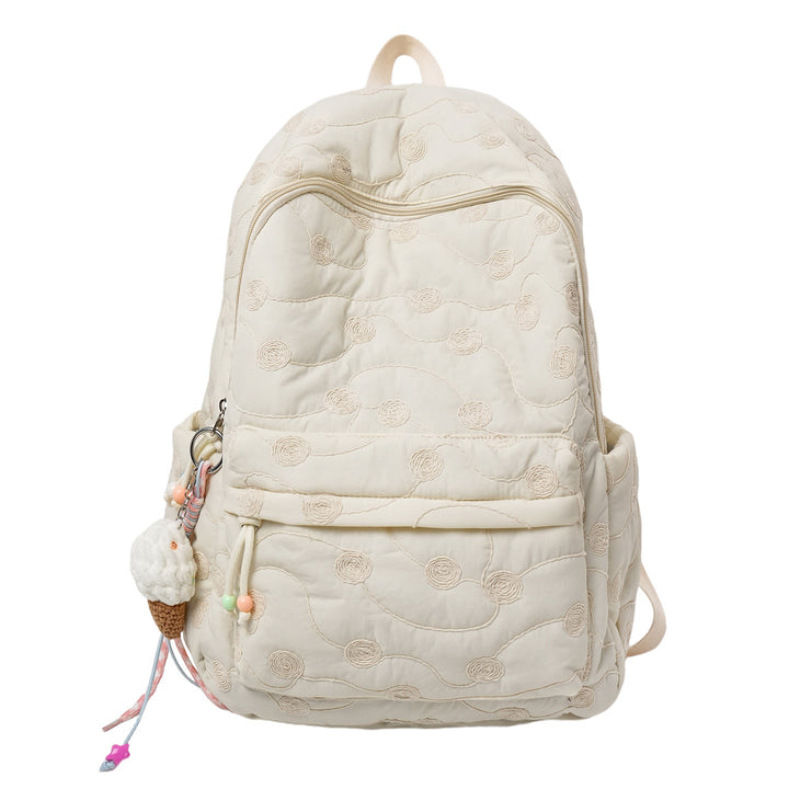 Stylish pink quilted women's backpack with floral embroidery, ideal for fashion-forward daily wear.