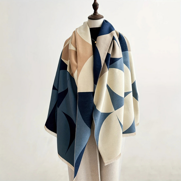 Women's reversible poncho scarf, a versatile layering piece for chic and cozy travel fashion.