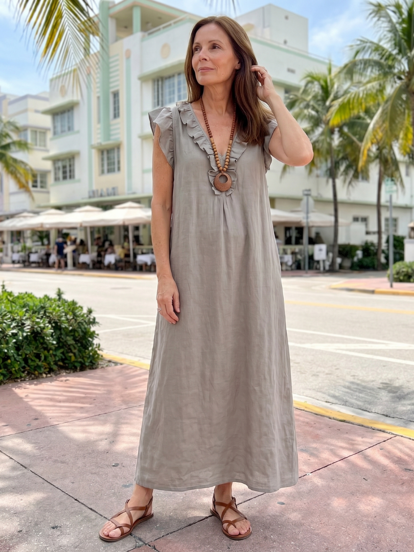 Versatile women's casual midi dress with a sleeveless V-neck and elegant ruffle details.
