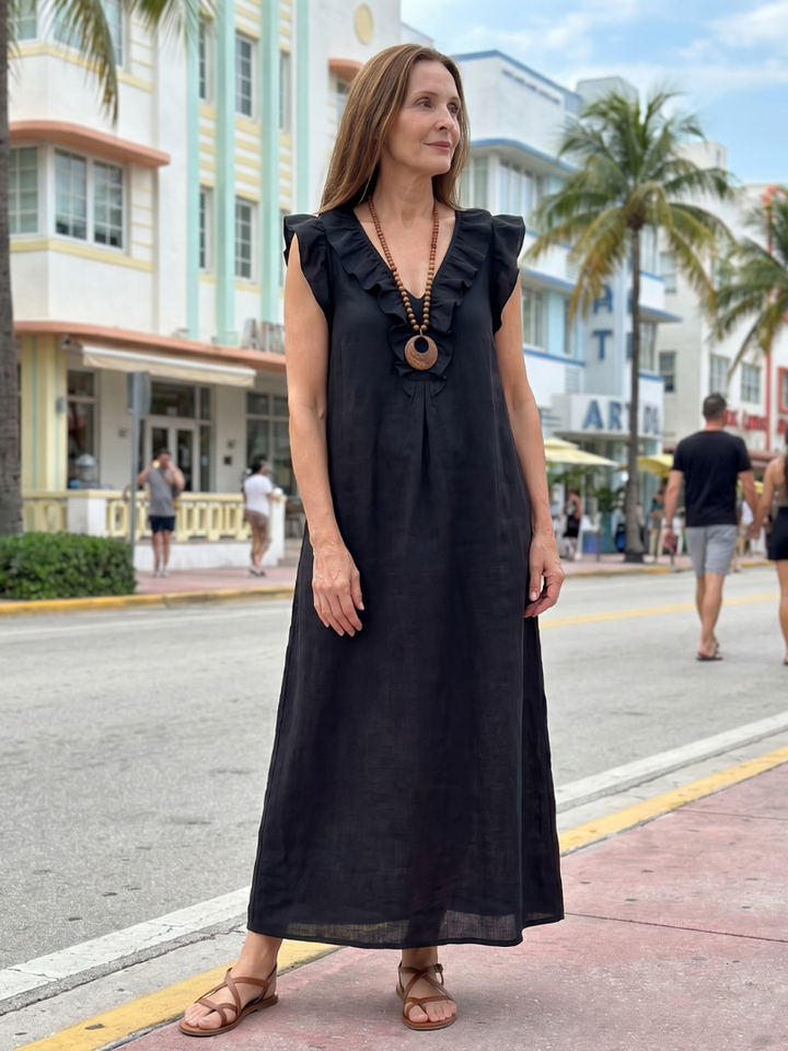 Relaxed fit women's sleeveless V-neck midi dress, featuring fashionable ruffle trim for summer.