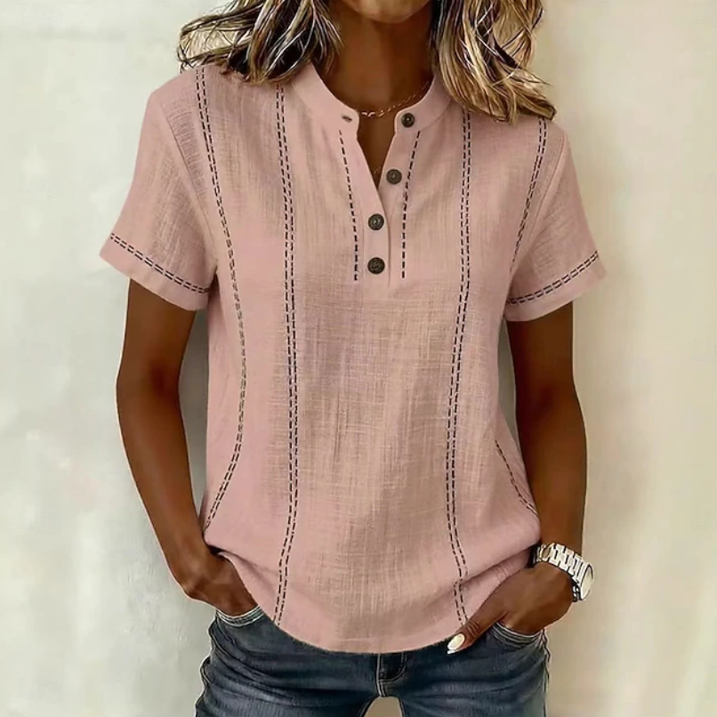 Women's casual Henley shirt with textured fabric & button-up detail, ideal for everyday spring/summer style.