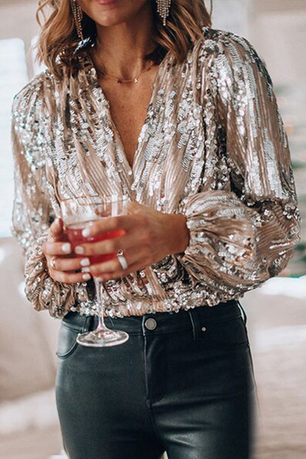 Elegant silver blouse for women. This chic ladies' top offers a shimmering look for party or casual wear.