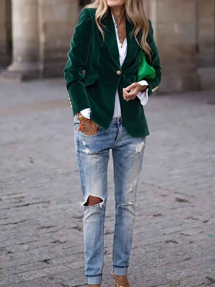 Contemporary women's tailored jacket, single button, blending business with modern fashion trends.