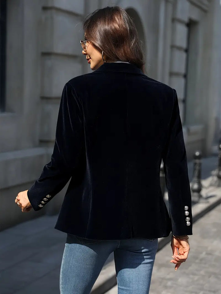 Stylish women's tailored blazer, single button closure, great for business and smart casual outfits.