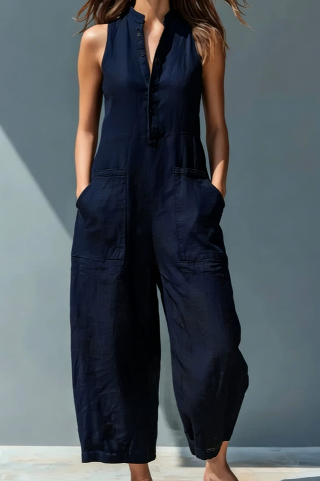 Fashionable women's sleeveless jumpsuit with stand collar & wide leg. A chic & versatile spring/summer outfit.