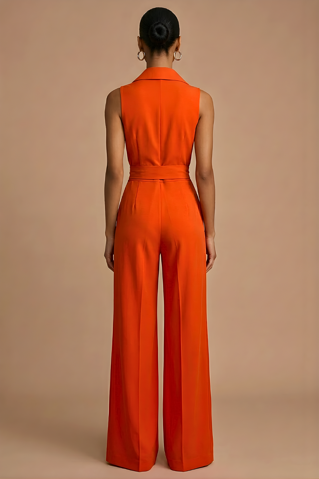 Stylish women's sleeveless wide-leg jumpsuit in orange with a collar neck, button front & waist tie. Versatile formal/casual.