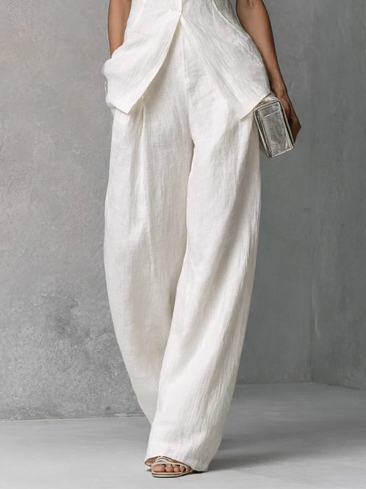 Elegant women's sleeveless top & wide leg pants set, offering a chic, effortless look for summer occasions.