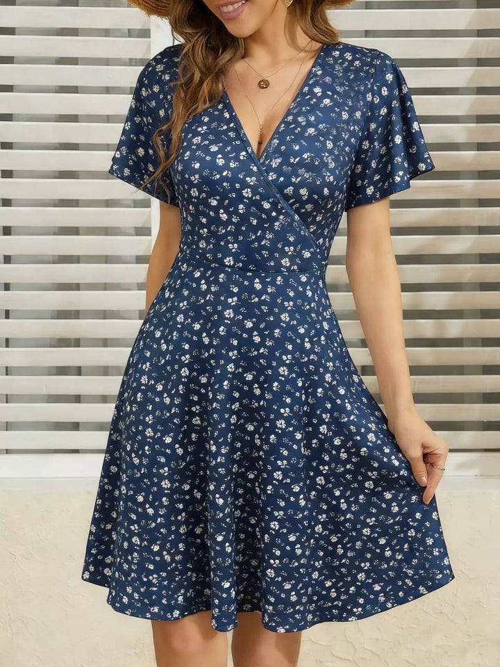 Lightweight women's polka dot V-neck dress. Comfortable summer style, ideal for daywear, chic & flowy.
