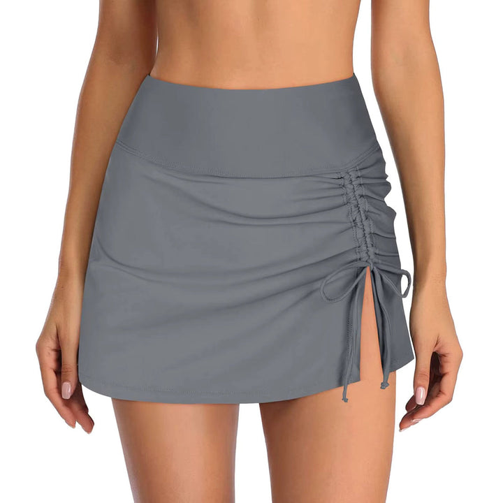 Women's active swim shorts featuring a side slit design & adjustable waist. Ideal for summer beachwear.