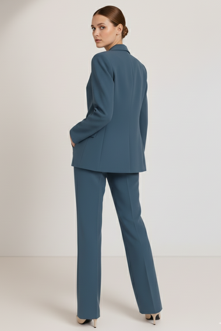 Detail of a women's professional suit: tailored blazer lapel & fabric texture of a chic business outfit.