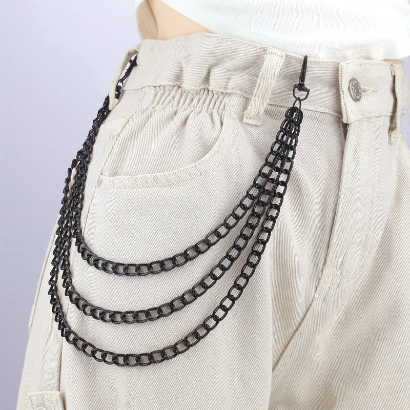 Chic women's triple gold-tone chain belt, perfect for fashionable waist styling or hip accent. Trendy accessory.