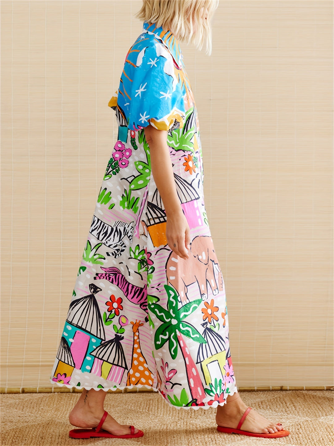 Full length view of a women's chic tropical print midi dress with lapel collar for elegant summer style.