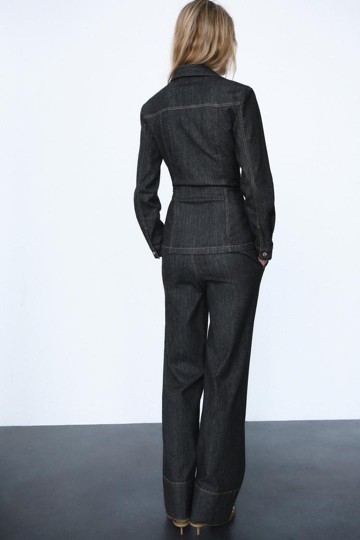 Comfortable women's co-ord set with a stylish fitted top and trousers. Versatile for casual wear or an elegant outfit.