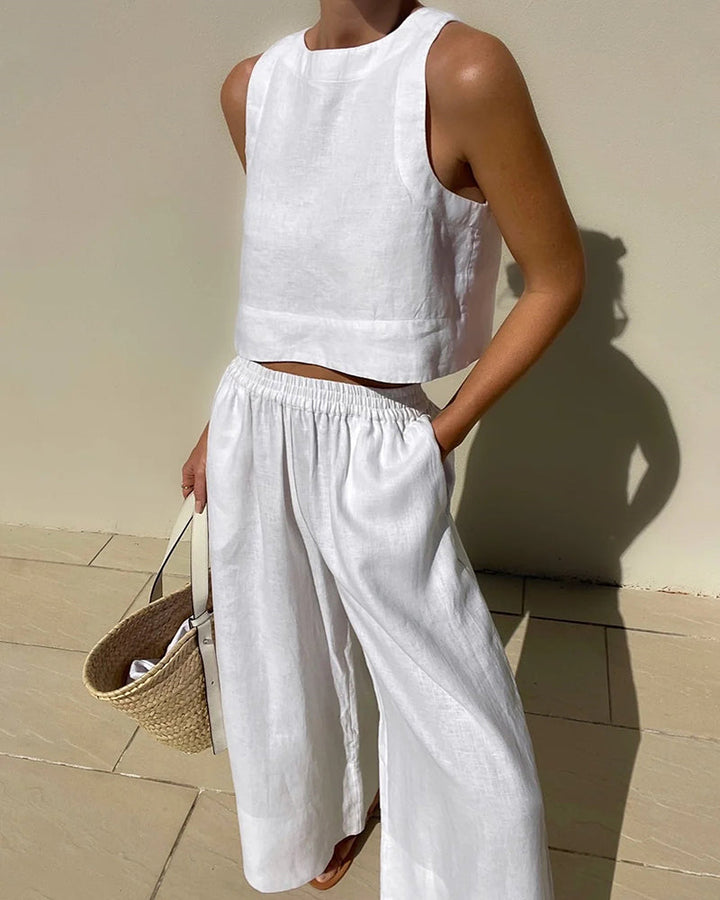 Chic women's two-piece set featuring a stylish crop top & wide-leg pants, perfect for summer casual wear.